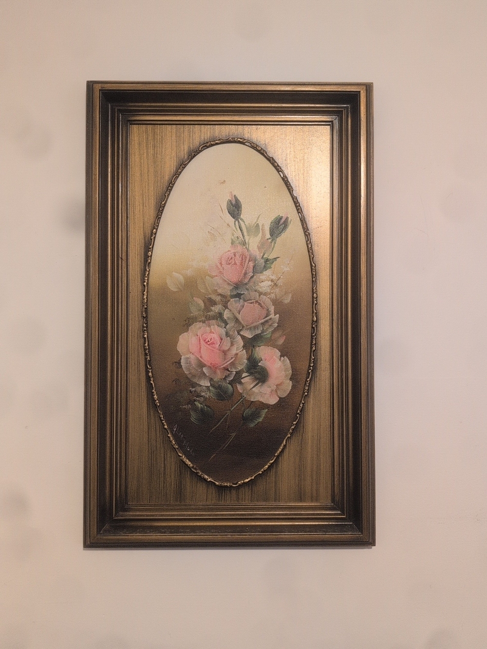 Ornate, carved rectangular frame with an oval opening for the artwork.